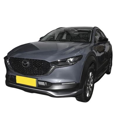 Καλή τιμή. 450 χιλιόμετρα Range Mazda CX 30 EV Ηλεκτρικό όχημα Αυτοκίνητο σε λευκό / μπλε / κόκκινο / πλατινένιο ατσάλι γκρι / ακραίο γκρι με από τη Mazda σε απευθείας σύνδεση